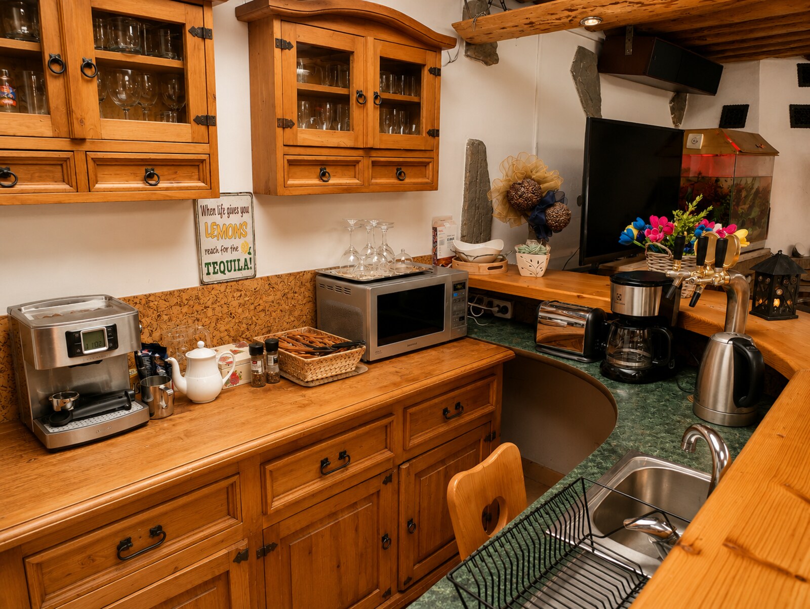 Shared kitchen with coffee machine and wooden furniture